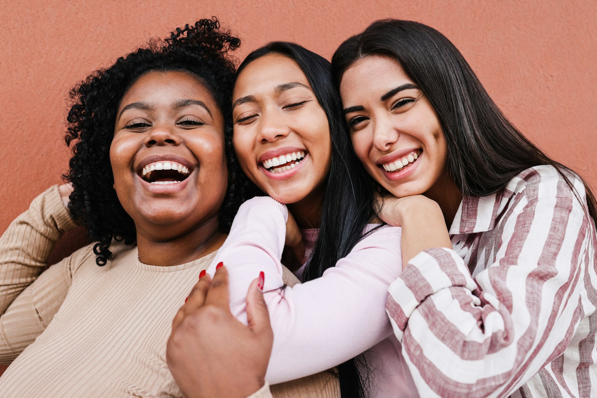 a group of women standing next to each other